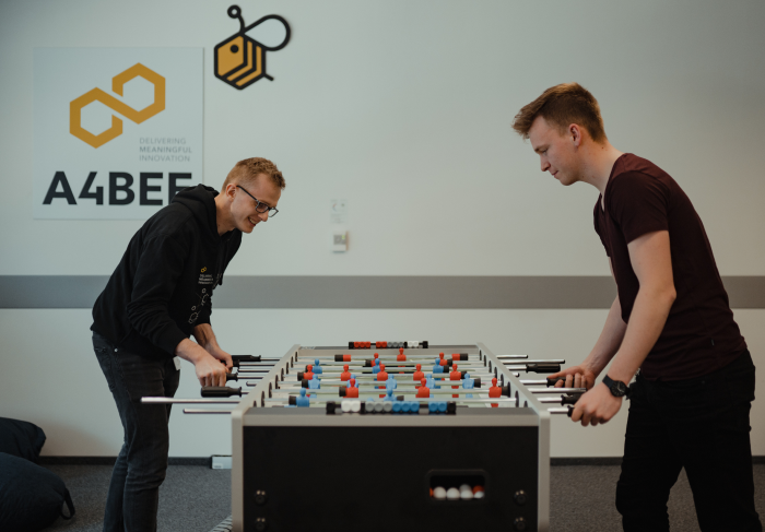 Two people playing table football