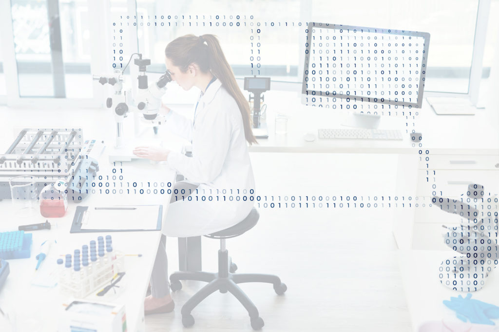 A woman in a lab. looking through a microscope